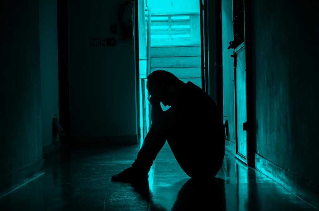 Person reflecting on recovery and seeking treatment support